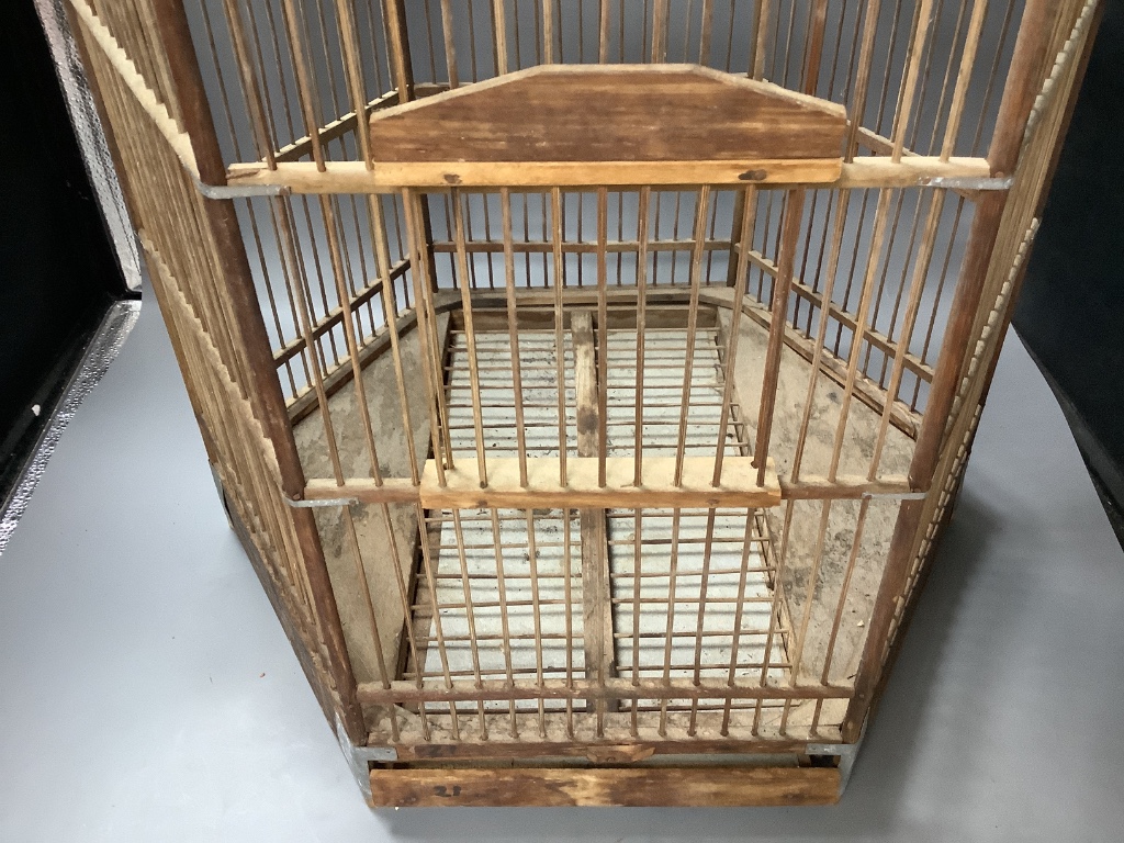 An hexagonal wood birdcage